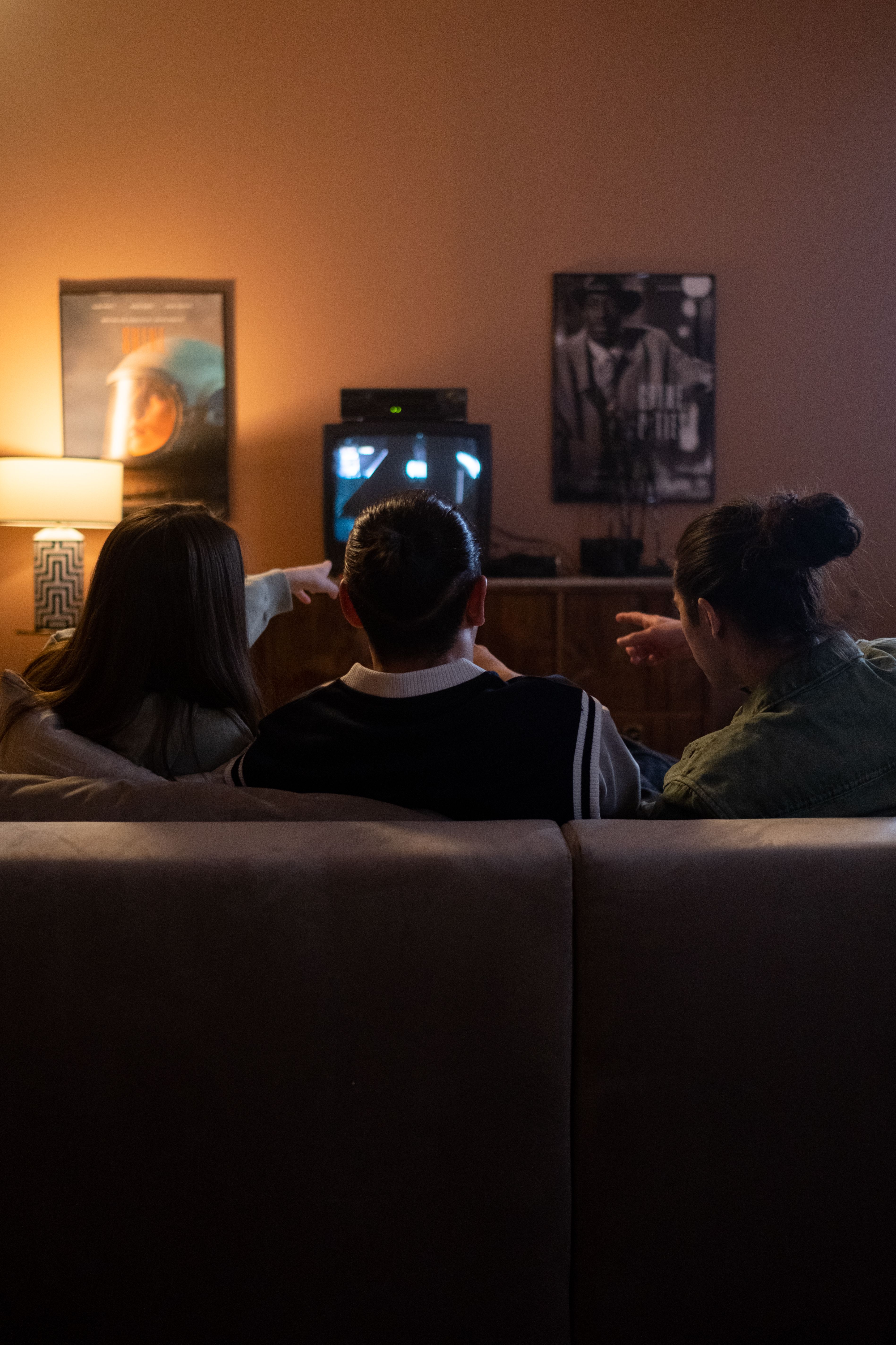 Friends watching television together